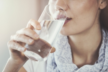 woman drinking glass of water