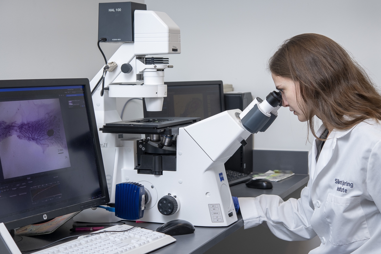 Dr. Jenny Kay at the microscope