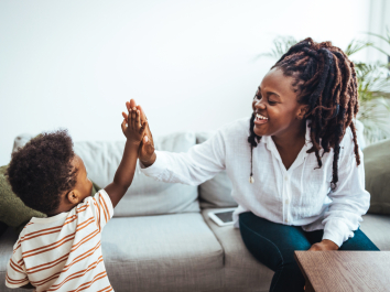 mother and son on couch