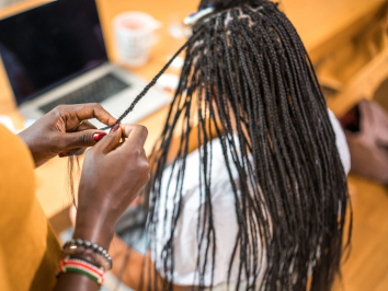 woman getting braided hair extensions