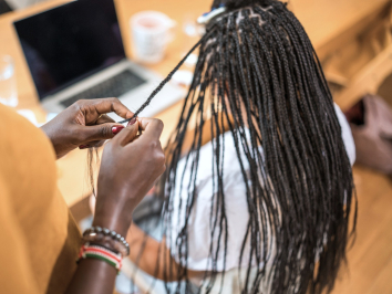 woman getting braided hair extensions
