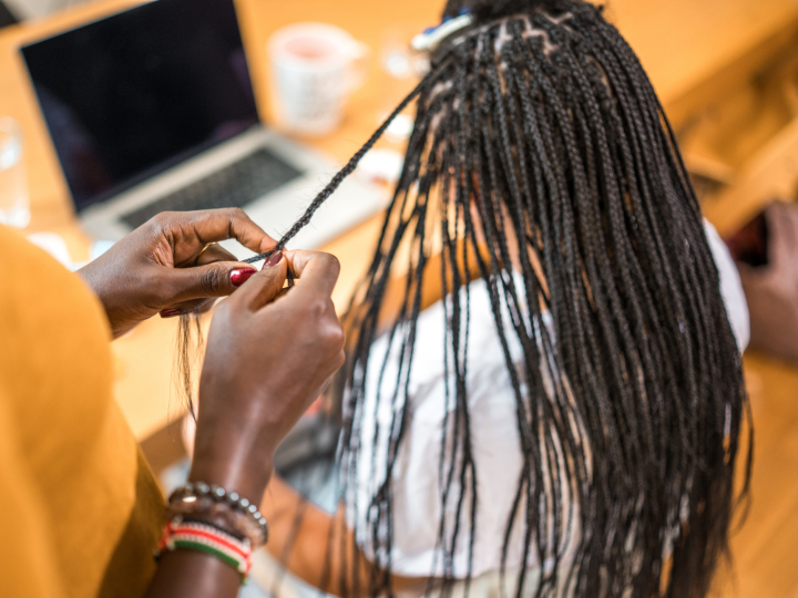 woman getting braided hair extensions